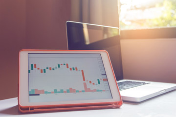 Fototapeta premium Stock trading forex on tablet on a white Table