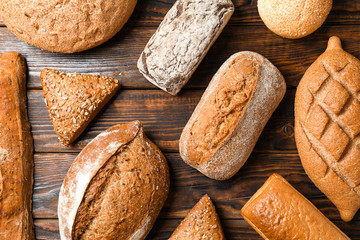 Flat lay composition with bakery products on wooden background, top view and closeup
