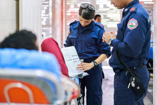 Firefighter paramedic with patient