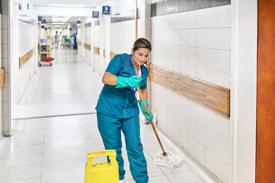 Woman cleaning a hospital corridor