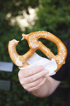 Playing tourist in Central Park NYC eating a pretzel