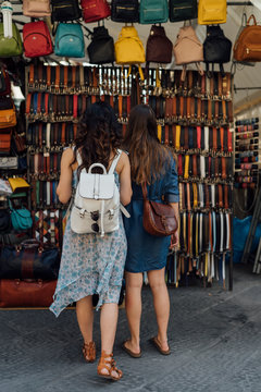 Two young Female Friends Shopping in a Italian Market in Florenc