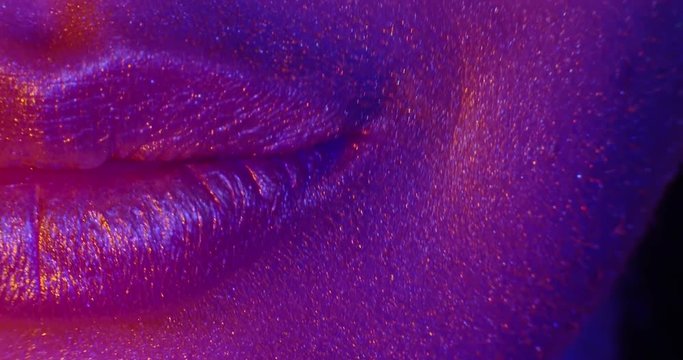 Girl's Face Part With Beautiful Golden Face.  Lips.Teeth Braces. Smile. 4K. Macro.