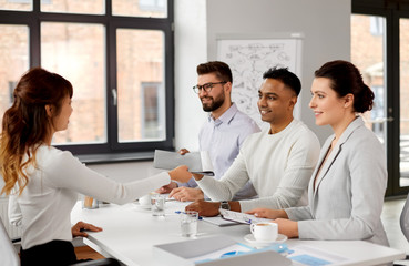 new job, hiring and employment concept - international team of recruiters having interview with...