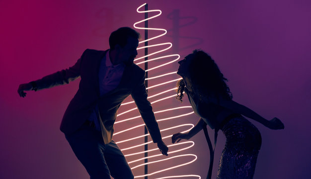 Couple Dancing On New Year Party - Powered by Adobe