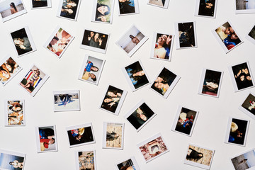 Instant pics arranged on white background.