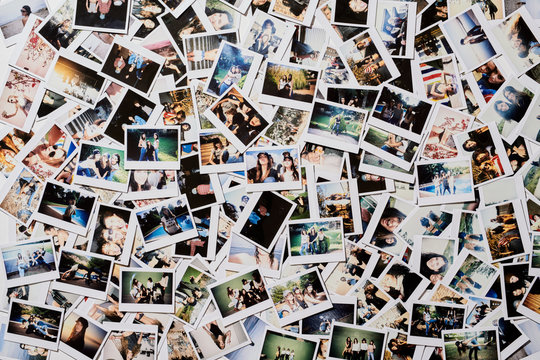 Many polaroid pics scattered on the floor.