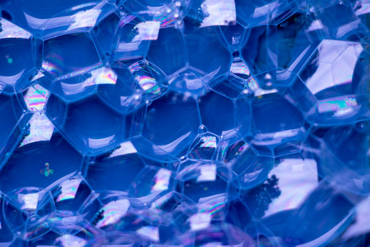 Blue Bubble Cells Background Texture.  Hive like pattern with a deep blue background. Interesting texture full of hexagons.