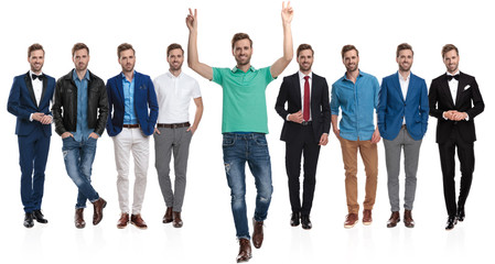 Fototapeta premium Man gesturing peace in front of a team of himselfs