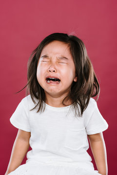 Portrait of crying toddler girl
