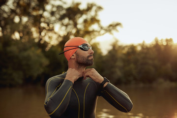 Man preparing for swimming in the river.