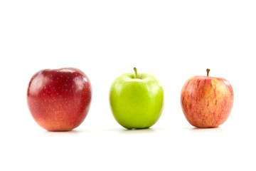 three different apples on white background