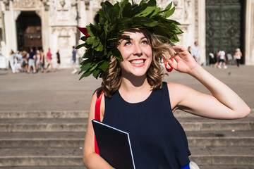 Happy young woman celebrating graduation
