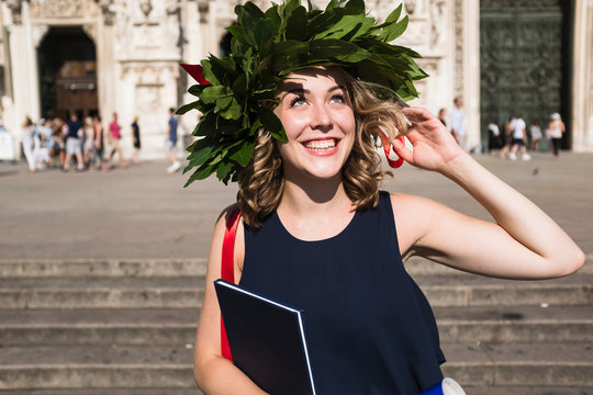 Happy young woman celebrating graduation