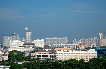 Elevated view cityscape of modern architecture buildings over blue clear sky in downtown Pattaya, Thailand
