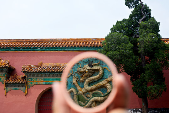 The details of the Forbidden City building are seen in the mirror. Forbidden City, Beijing, China.