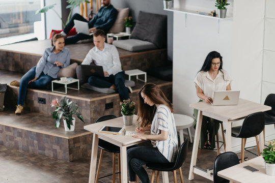 People working separately in the co-working office space