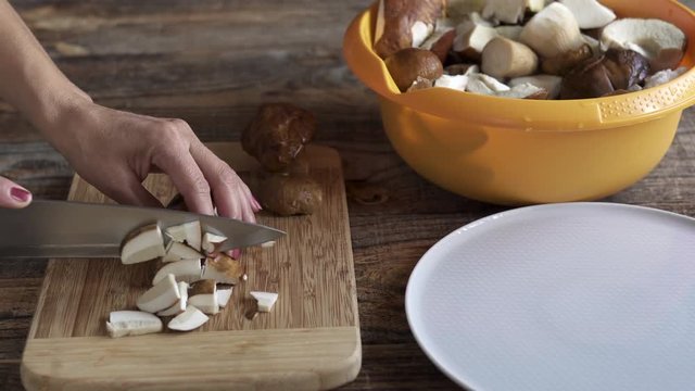 Woman slicing mushrooms