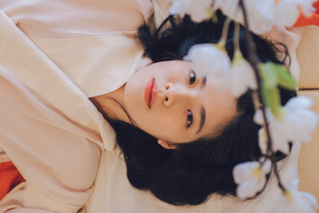 sexy Asian woman in kimono in bedroom