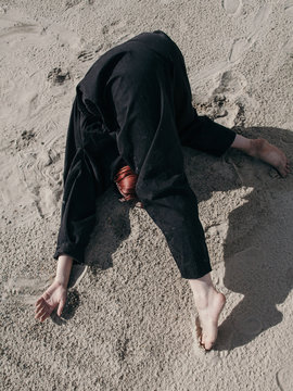Anonymous model dancing and hiding face