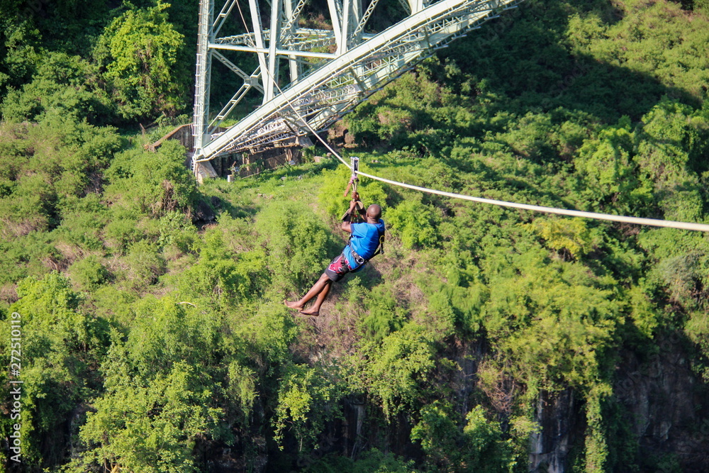 Wall mural zip lining at victoria falls, zimbabwe