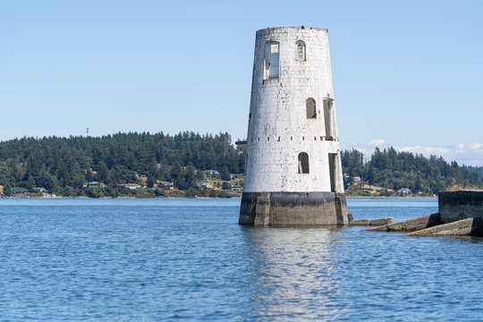 Abandoned lighthouse in the Puget Sound of Washington in the Pacific Northwest once used as a shipping port