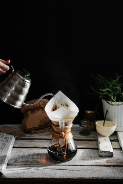Close up of woman's hand brewing coffee