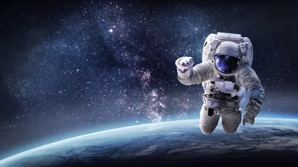 Foto op Canvas Astronaut in outer space on orbit of the Earth. Elements of this image furnished by NASA © dimazel