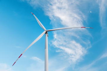 Windmill on blue sky background
