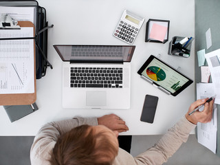 business man working looking at charts and graphs