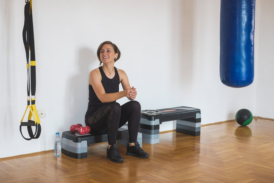 Woman Resting At The Gym In Between Exercises