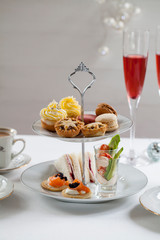 Christmas afternoon tea with turkey and cranberry sandwiches, crayfish cocktails, salmon bilinis, mince pies, cupcakes and macaroons