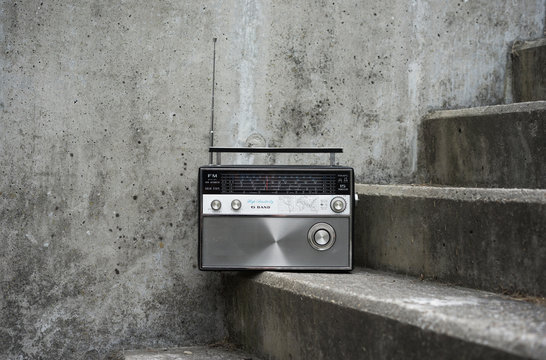 Vintage radio on concrete stairs