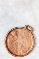 Round Wooden Dish on Grey Background