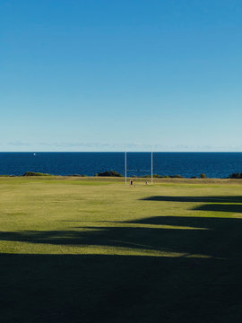 Australian Football pitch with ocean view.