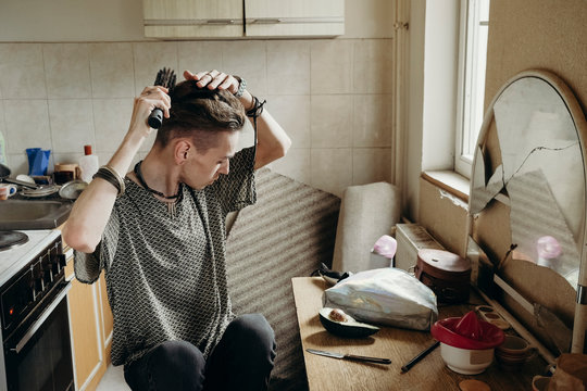 Portrait of a skinny young male model at home