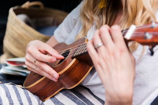 Strumming on ukulele