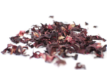 Hibiscus tea. Herbal tea.  Dry tea leaves isolated on white background