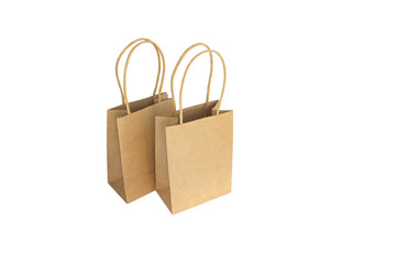 two brown paper shopping bags with hands isolated on white background