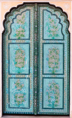Ancient green doorway in Hawa Mahal palace in Jaipur, India