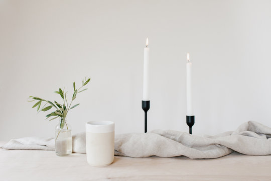 Olive branches in neutral table scene