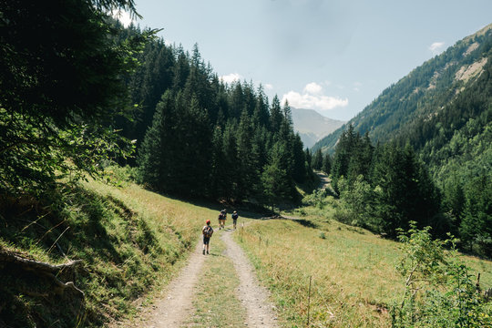 group of kids starting a hike in the Alps
