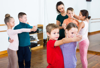 Little boys and girls dancing pair dance