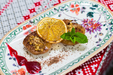 Sugar dessert wuth mint, lemon, nuts ant cooked peaches on beautiful plate. Food , menu concept