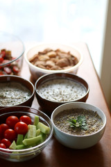 Table setting with galette, snacks, dips and salads. Selective focus.