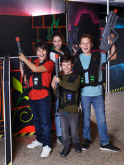 Obraz na płótnie Canvas Kids posing with laser pistols