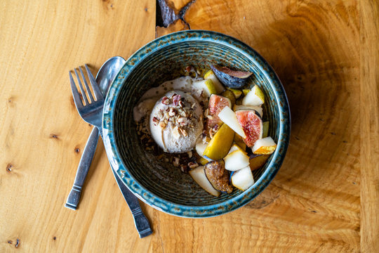 Ice cream dessert showcasing local, organic, and fresh ingredients from the Pacific Northwest. Honey, pear, fig, hazelnut, and plum.