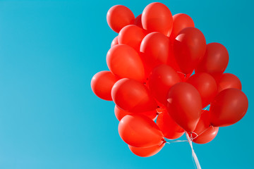 Red balloons in the blue sky