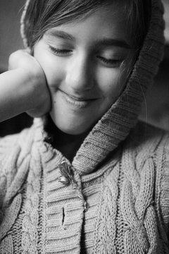 Girl Wearing Sweater With Hood Smiling With Eyes Closed
