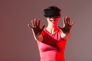 beautiful young woman wearing virtual reality glasses	